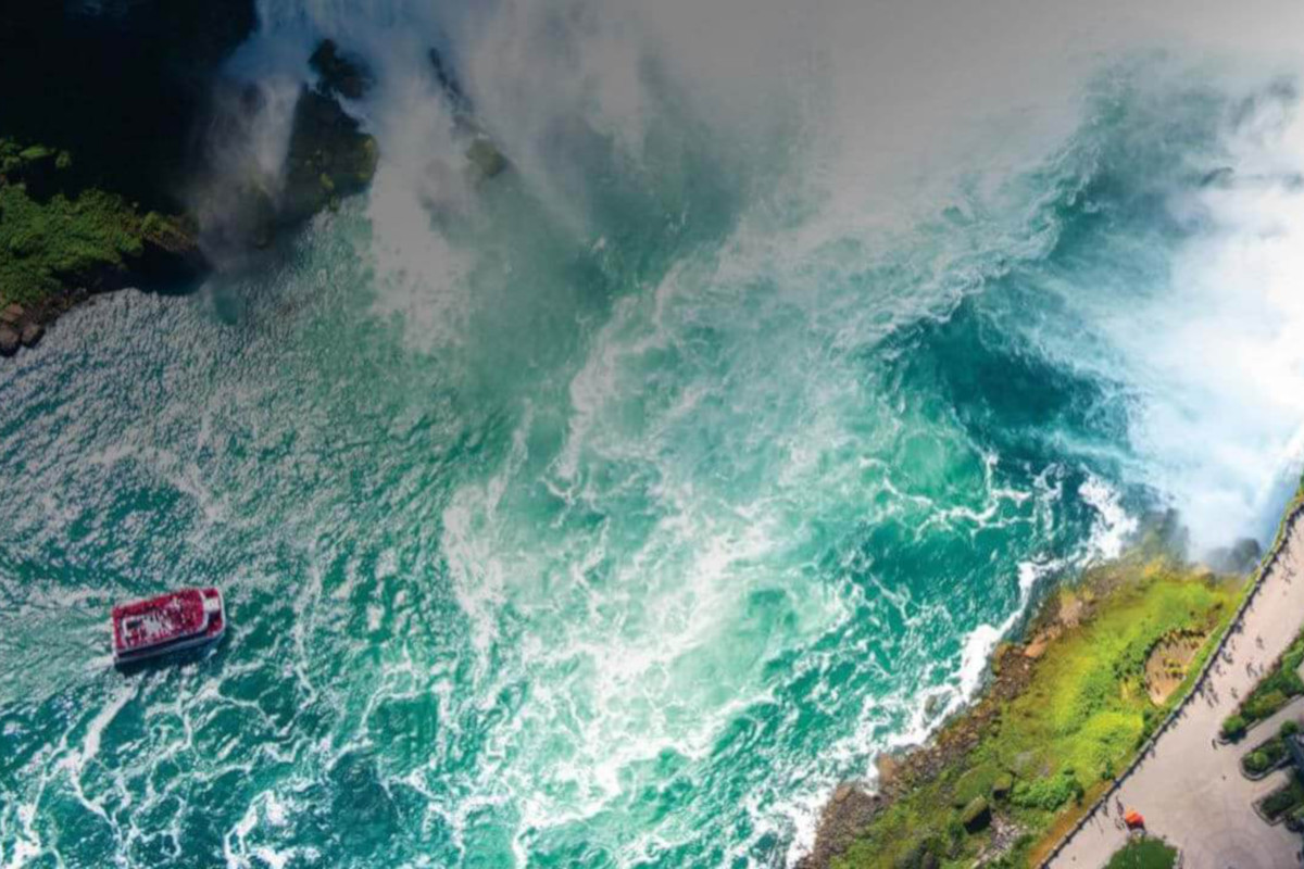 Aerial view of a Maid of the Mist cruise boat approaching the Horseshoe Falls